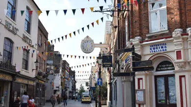View of a typical UK town highstreet with shop fronts and bunting