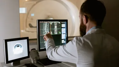 Healthcare professional monitoring an MRI scan and viewing the results