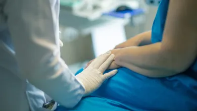 A doctor reassures a patient