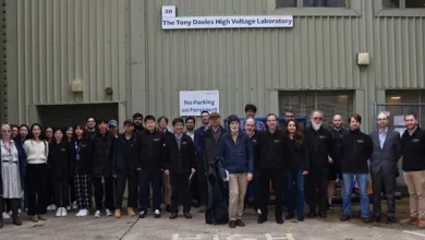 Group of researchers and students in front of the Tony Davies High Voltage laboratory