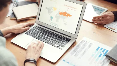 Office meeting on a table with laptop and tablet