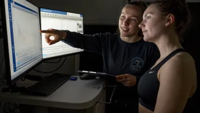 A researcher and participant discussing test results