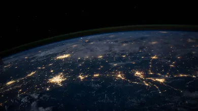 A dark aerial view of earth from outer space