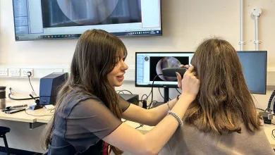 Isabel-McGauley examining patient
