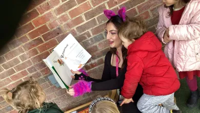 Staff of the Early Years Centre with children