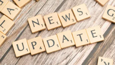 Text reading News Update, made of dominoes letters
