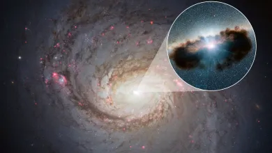 A satellite image of a galaxy, with a box zooming in on the centre and revealing a supermassive black hole hidden behind a cloud of gas and dust.