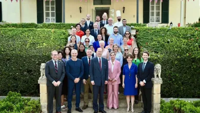 Their Royal Highnesses the Duke and Duchess of Edinburgh, Jacob Brooks and the embassy staff standing on the steps outside the British embassy in Malta.