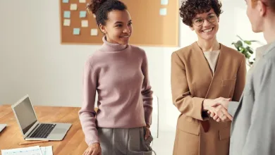 image of people in the workplace shaking hands