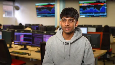 Vinay sitting in the Financial laboratory at Southampton