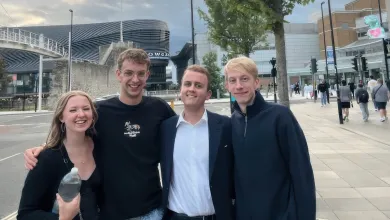 Daniel (second from the right) stands with arms around 3 friends he made on his course