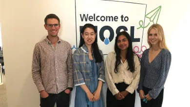 4 students standing in front of a MOSL sign.