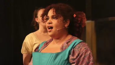 BA English student performing Shakespear on a stage.