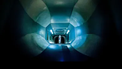 View through a wind tunnel towards a cyclist undergoing aerodynamic testing