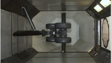 Overhead view of aircraft landing gear mounted inside a test chamber