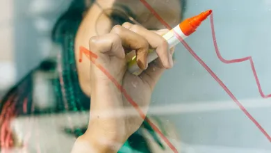 A person drawing a chart on a whiteboard