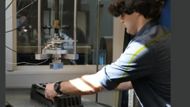 Researcher conducting a laboratory test using specialist materials testing equipment