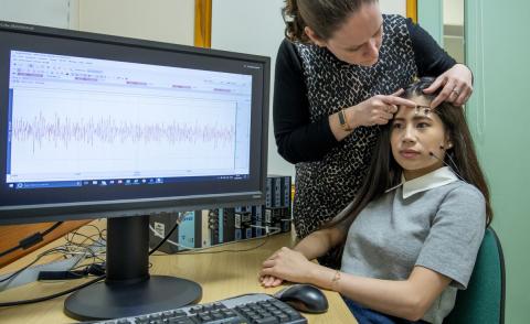 A study participant is prepared for a facial electromyography experiment