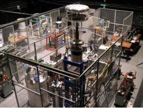 Large cage containing commercial testing equipment