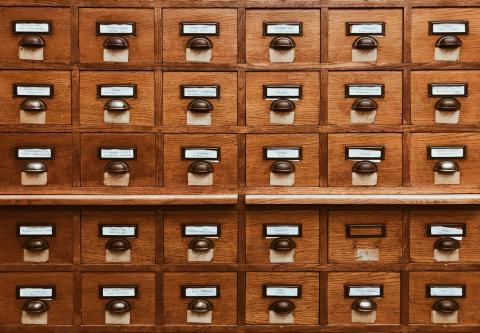 A block of wooden card catalogue drawers