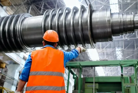 A technician in a high voltage components factory