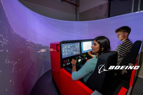 Two students use the Boeing flight simulator