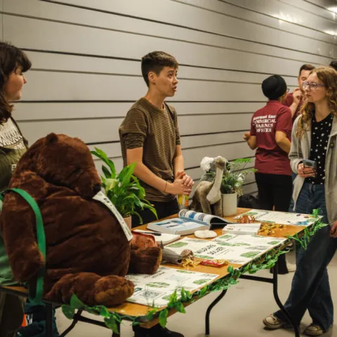 Students at a SUSU event stand