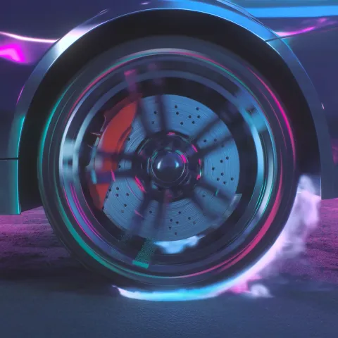 Close-up of a car wheel in motion, showing a spinning brake disc and caliper with visible brake dust and smoke.