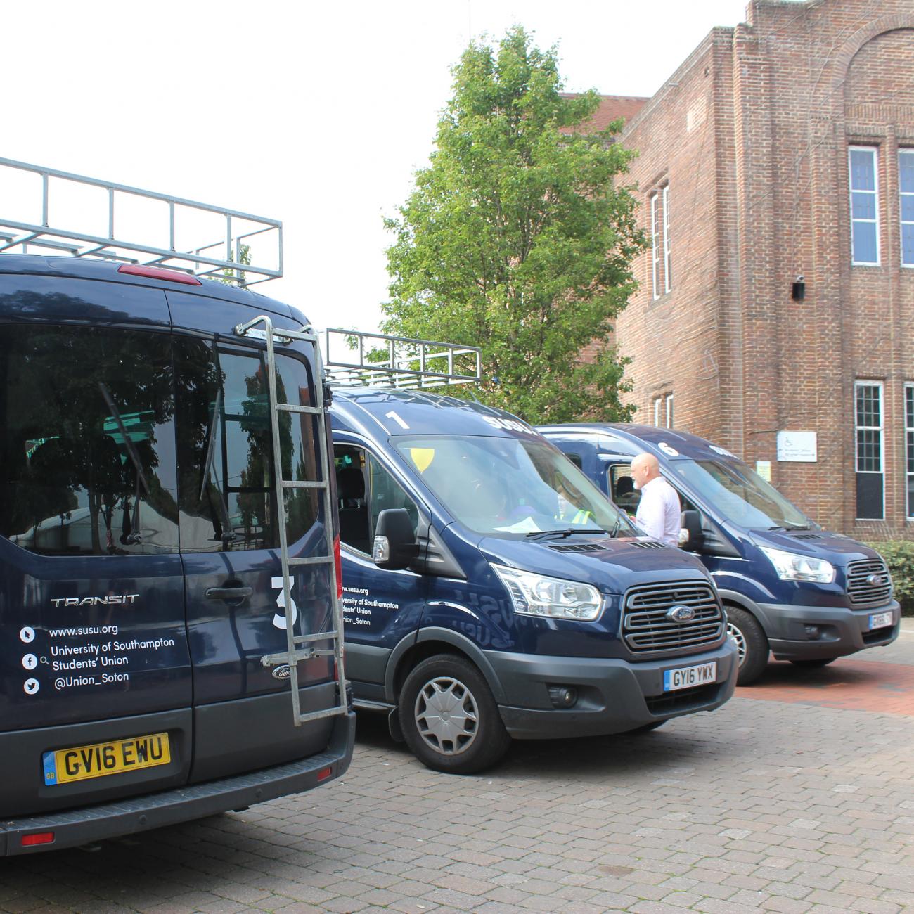 SUSU mini-buses parked outside the Students' Union. 