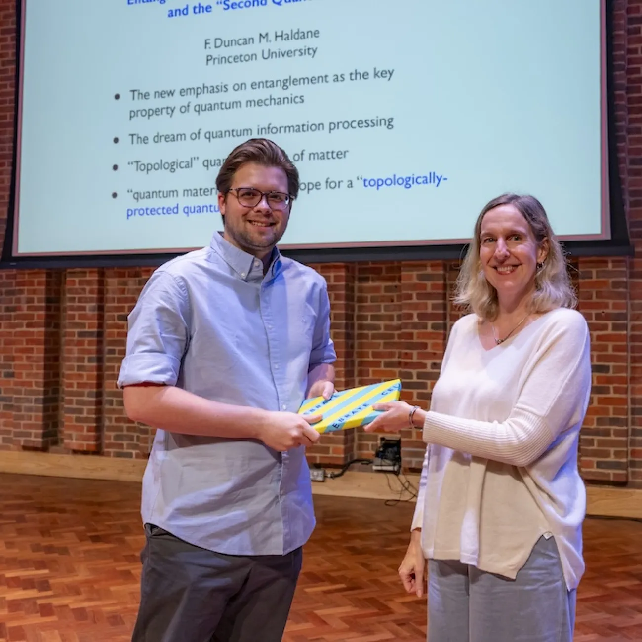 Austen Wallis being presented with prize