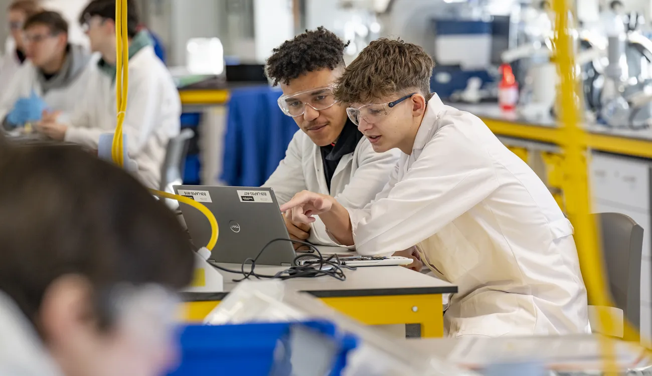 Undergraduate students analyse data they obtained in the teaching laboratories.