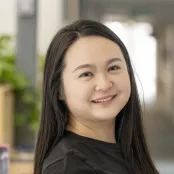 Head and shoulders portrait image of Yuzhen Fu smiling at the camera.
