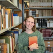 Ella Meekings, History student, in the library