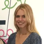 Portrait image of economics student smiling at the camera.