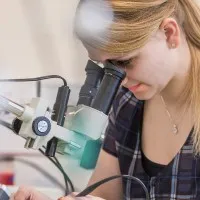 undergraduate mechatronic looking through a telescope