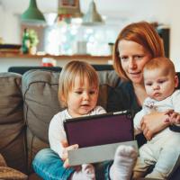 Mum with children using a tablet