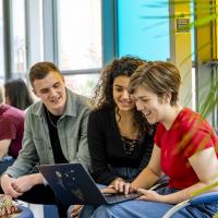 Modern Language students sharing laptop 