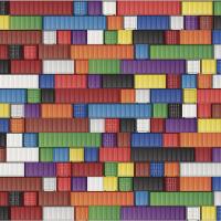 A colourful checkerboard of shipping containers viewed from a great height
