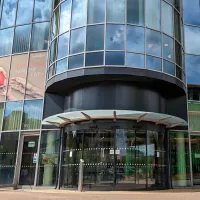 Exterior view of the modern glass-fronted building that houses the Institute of Developmental Sciences.