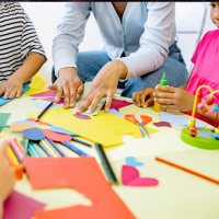 Pexels image of children doing arts and crafts activities with a teacher