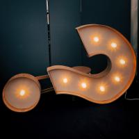 A large question mark on it's side containing lights