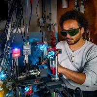 Performing experimental study of optical phase change materials using lasers to switch their response between crystalline and amorphous states.