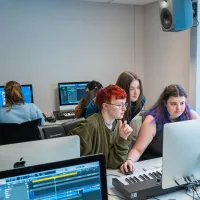 MA International Music Management students working on music on computer