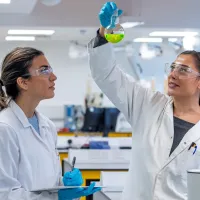 Two students working in the chemistry labs