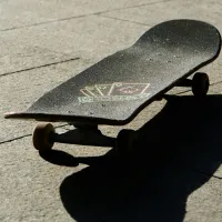 Skateboard on patio in sunshine