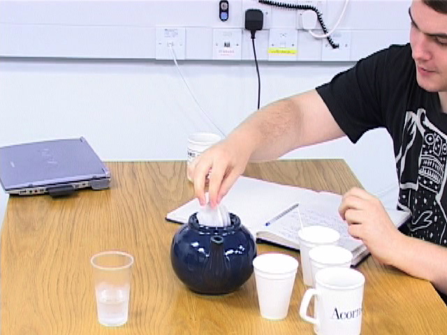 adding measured tea